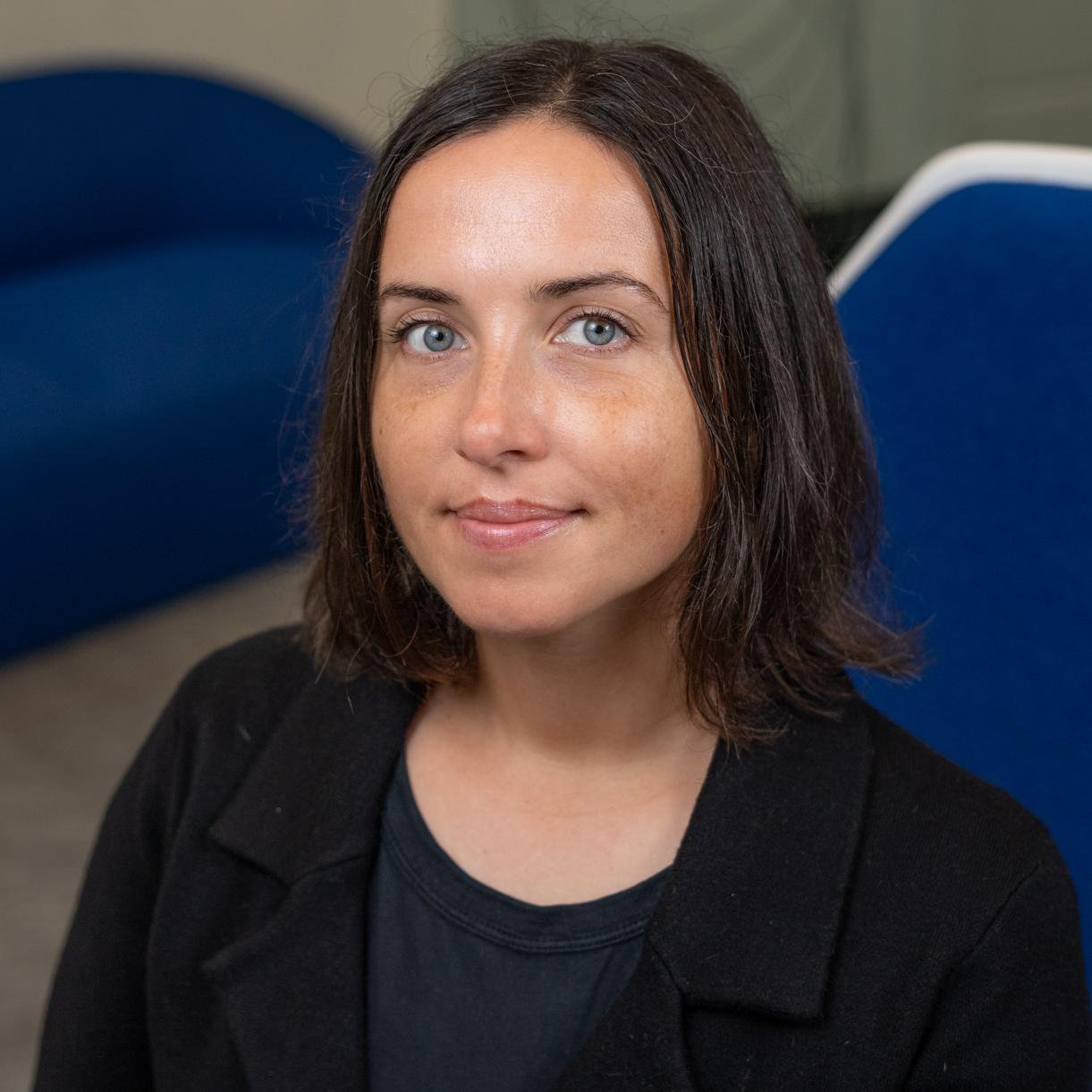 Woman sitting in a blue chair