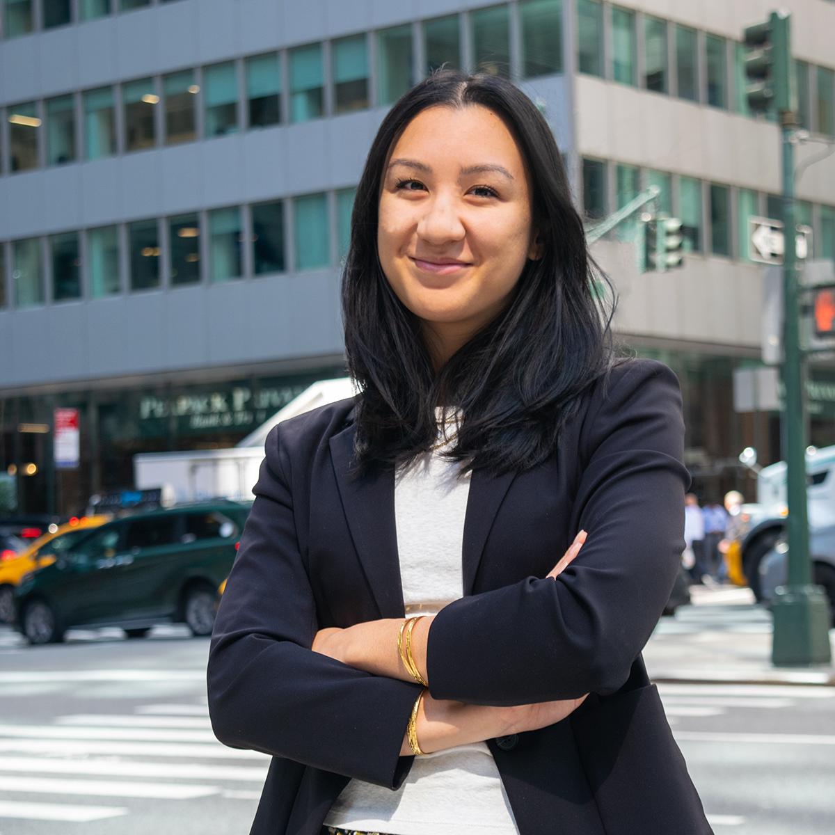 Navika Gangrade stands in front of a building in New York City