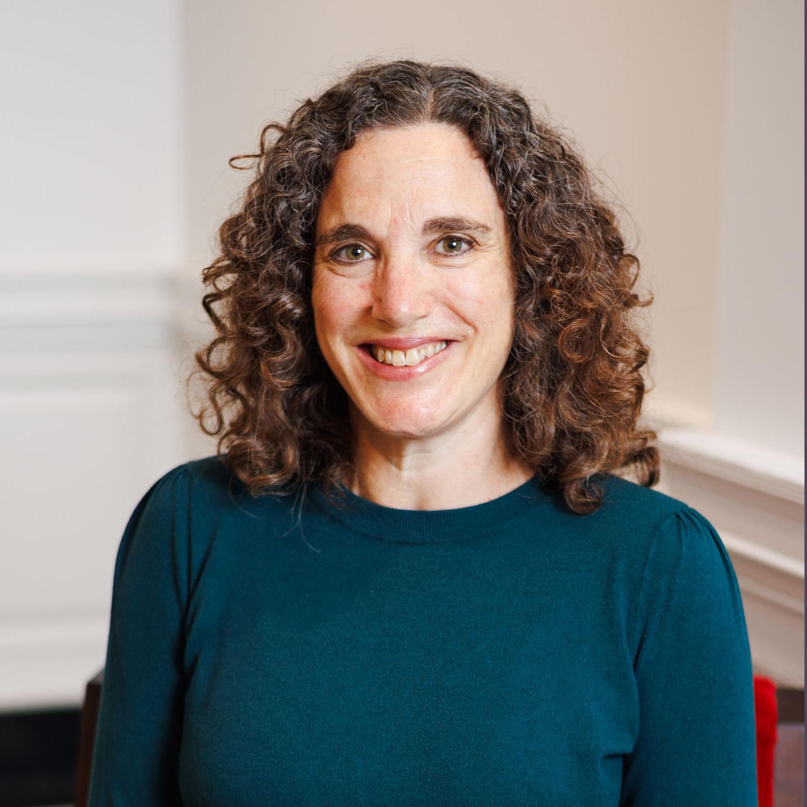 Portrait of Sharon Kaplan wearing a teal sweater