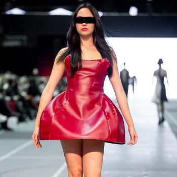 runway model in a short, red dress