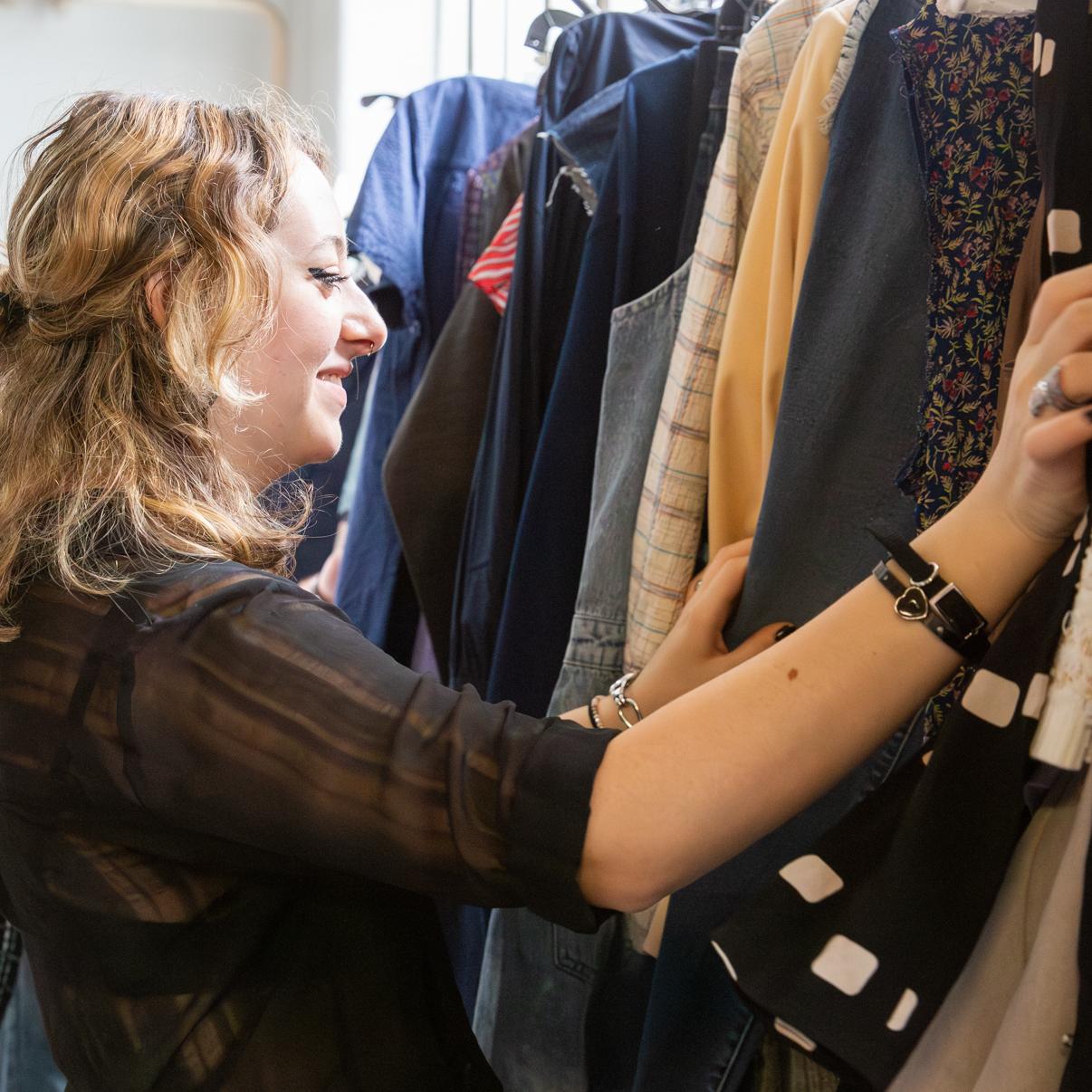 Student looking at garments