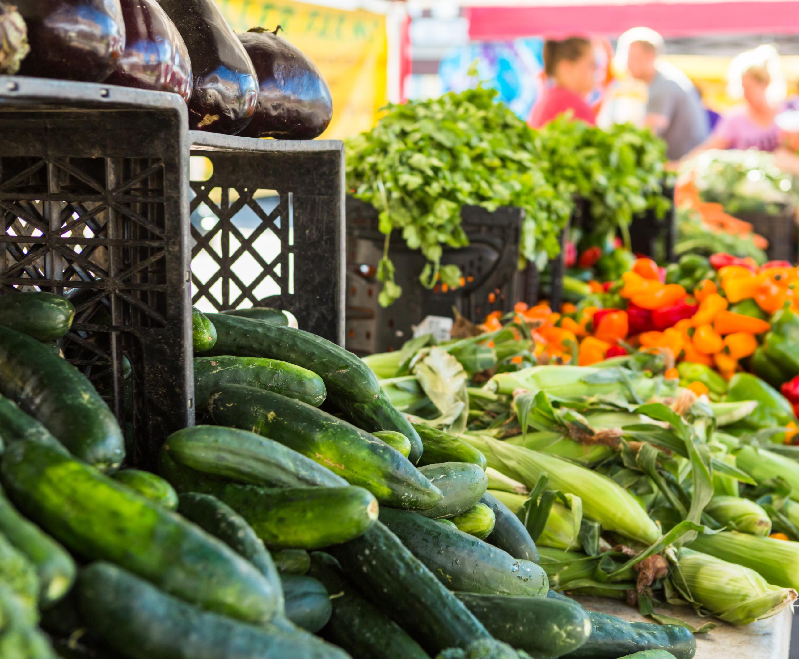 Cucumbers, corn and peppers at a farmer's market