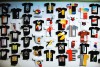 a wall of mini paper t-shirt designs