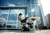 student sitting at a table in the sun