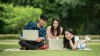 students with laptops outside