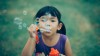 bubble blowing child