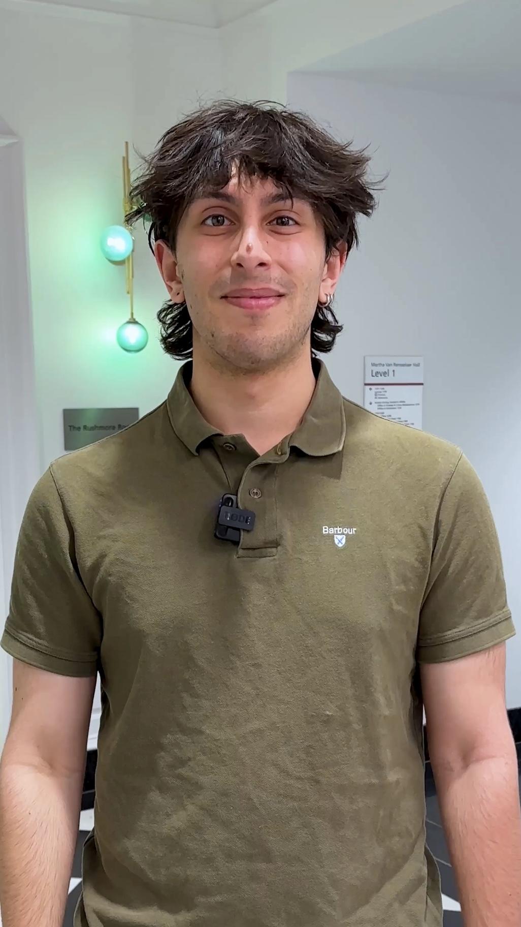 Omeed Moon standing in a hallway