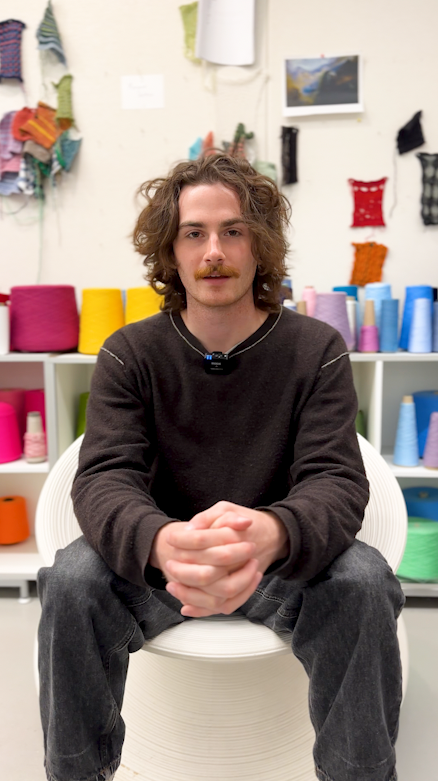 Ethan Drake sitting in a circular chair