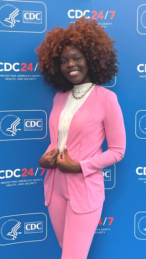 Lisa Quainoo in front of a CDC step-and-repeat